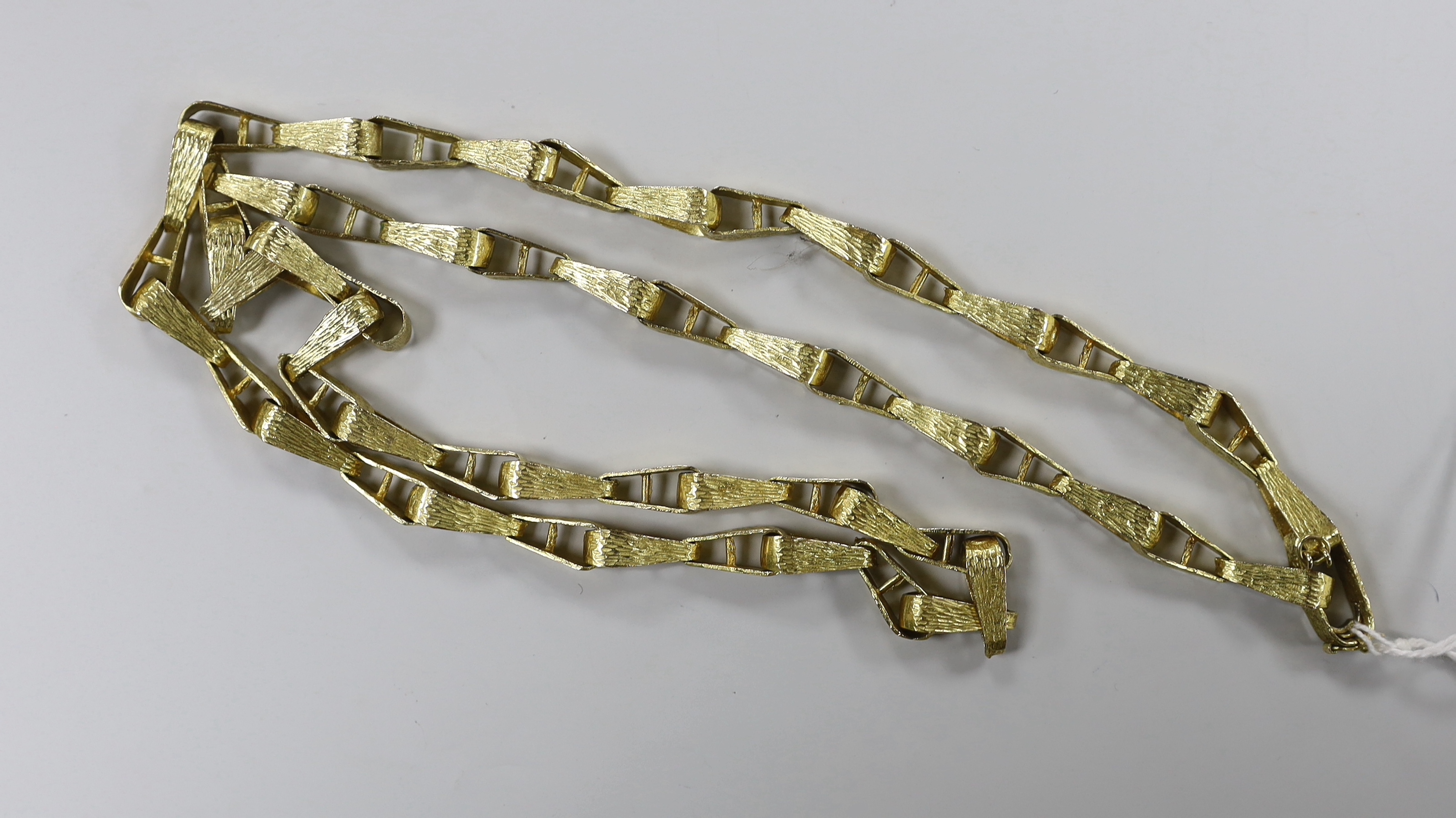 A 1970's textured 9ct gold tapered link necklace, 76cm, 57 grams.